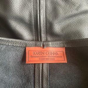 Genuine handmade leather  black purse.  Never used! Great condition!